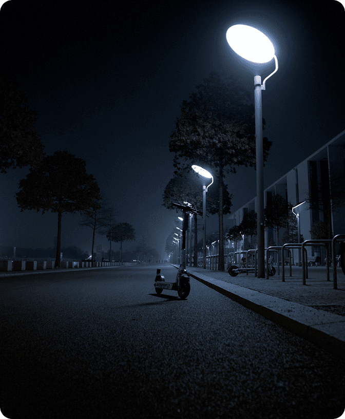 Electric scooter on a city path at night